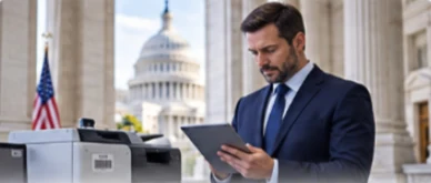 An official verifies equipment with a tablet in a government building